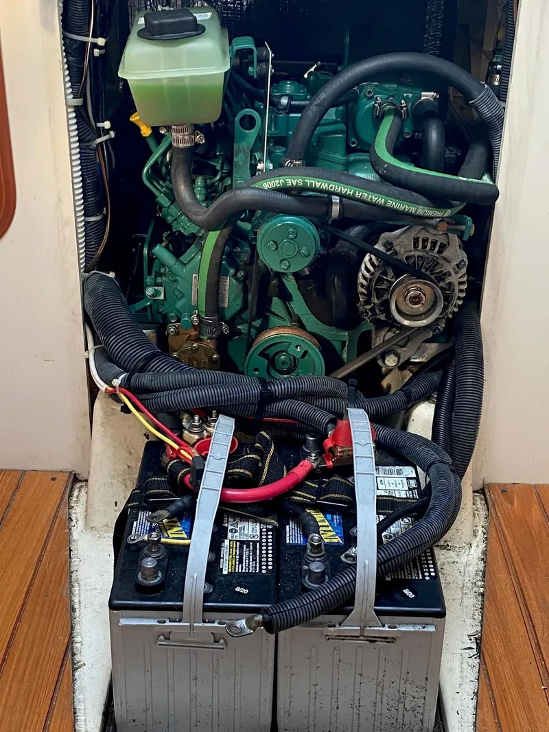 Slide: The Image of Engine compartment of a 2013 Tartan 101 sailboat with visible batteries and components. - 16
