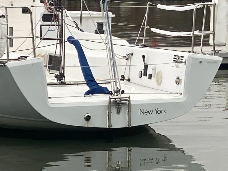 Slide: The Image of Sailboat Tartan 101, 2013 model, docked with "New York" on the stern. - 5