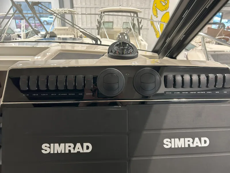 Slide: The Image of Control panel of 2025 Boston Whaler 325 Conquest with Simrad navigation systems. - 24