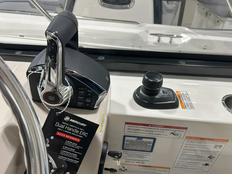 Slide: The Image of 2025 Boston Whaler 325 Conquest control panel with Mercury Dual Handle ERC. - 27