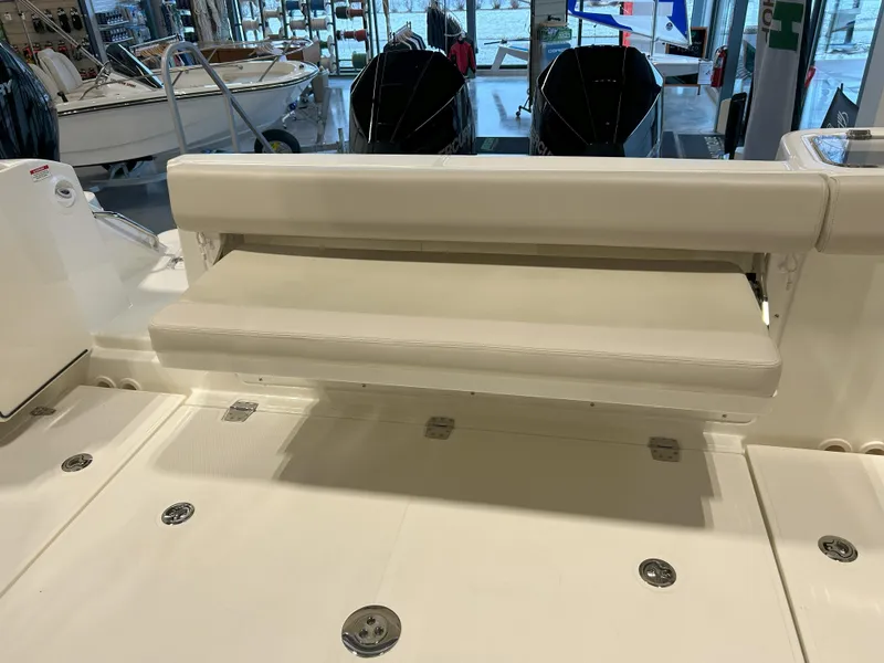 Slide: The Image of 2025 Boston Whaler 325 Conquest boat interior with foldable seating. - 45