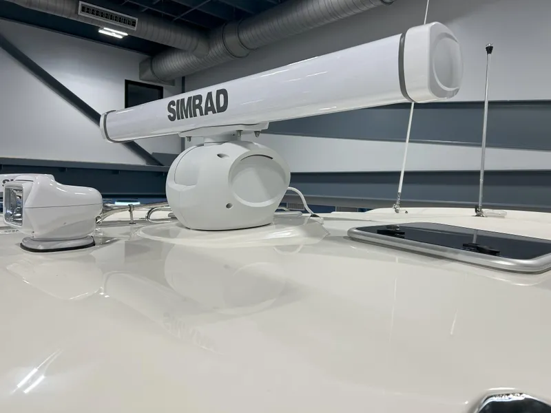 Slide: The Image of 2025 Boston Whaler 325 Conquest with Simrad radar system on deck. - 49