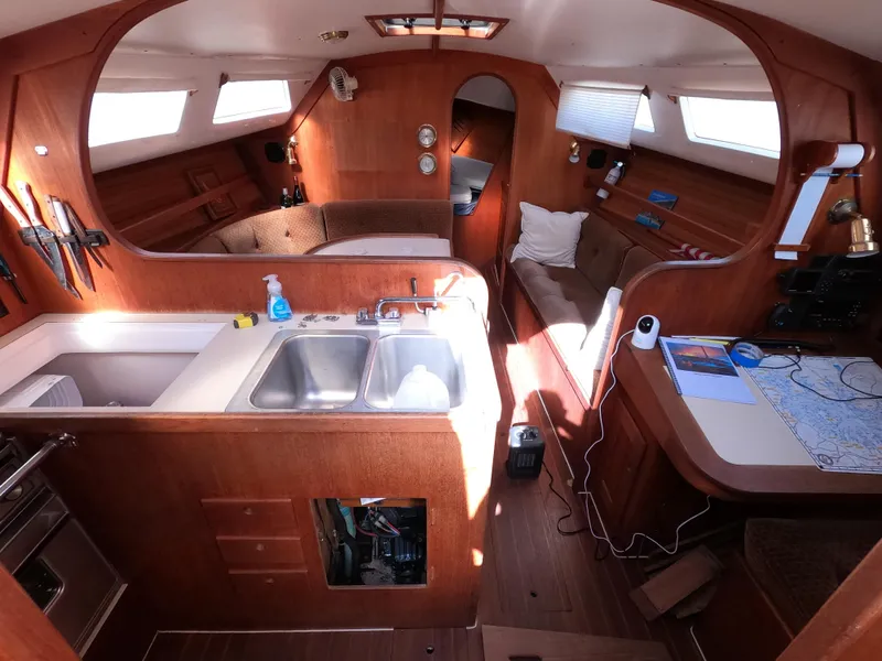 Slide: The Image of Interior of a 1984 Freedom 32 sailboat with kitchen and seating area. - 7