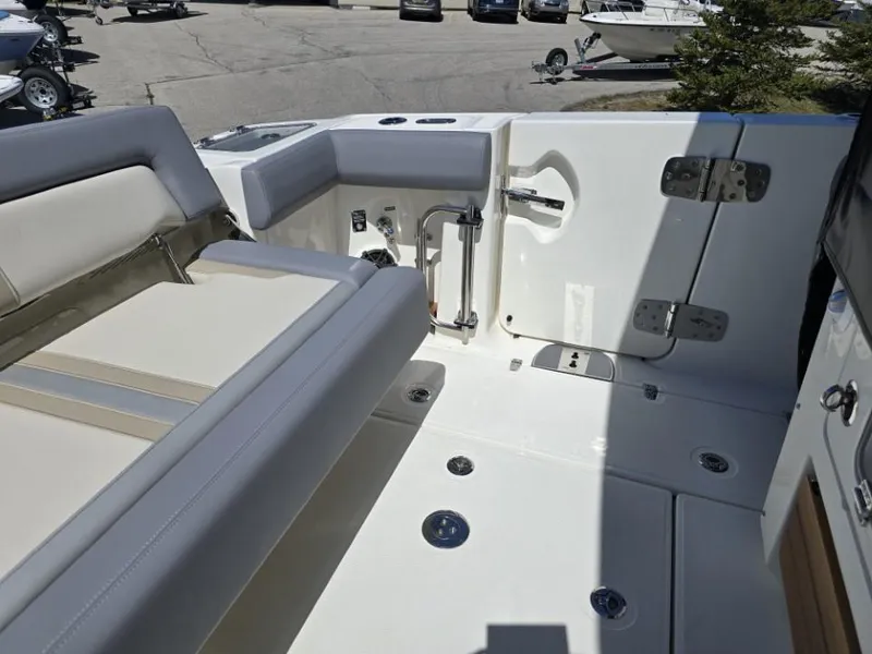 Slide: The Image of 2025 Boston Whaler 350 Realm boat interior with seating and deck details. - 7