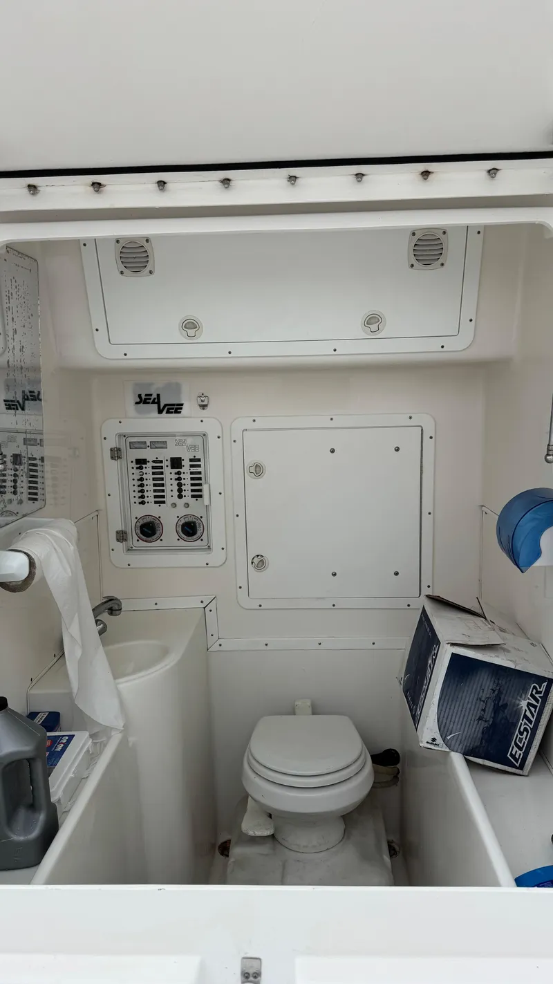Slide: The Image of 2003 SeaVee 34B boat interior with toilet and control panels. - 7