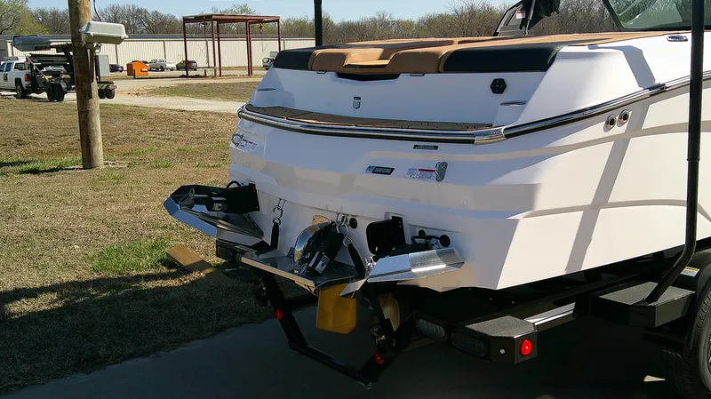 Slide: The Image of 2025 MasterCraft NXT22 boat rear view, showcasing sleek design and modern features. - 4