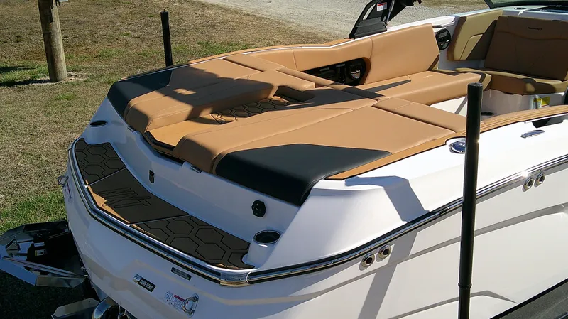 Slide: The Image of 2025 MasterCraft NXT22 boat with tan upholstery and sleek design. - 5