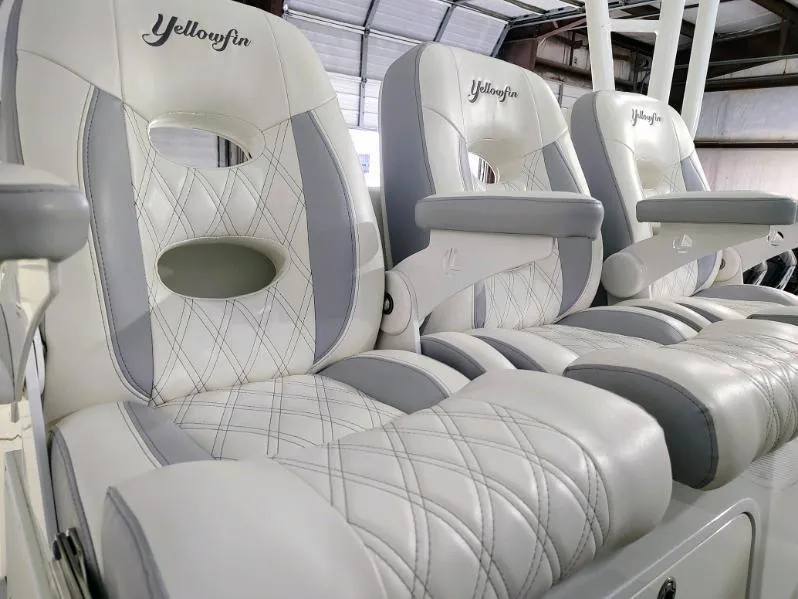 Slide: The Image of Luxury seating on 2014 Yellowfin 42 boat with elegant white and gray upholstery. - 7