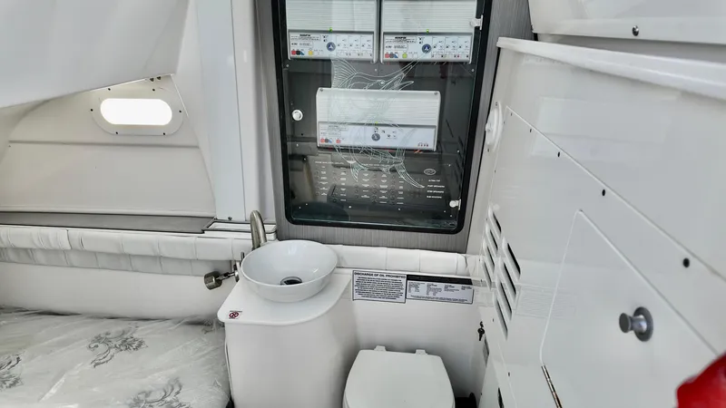 Slide: The Image of 2025 Sea Fox 368 Commander interior with compact sink and toilet setup. - 17