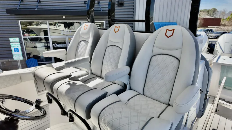 Slide: The Image of Luxury seating on 2025 Sea Fox 368 Commander boat, featuring elegant white upholstery and armrests. - 20