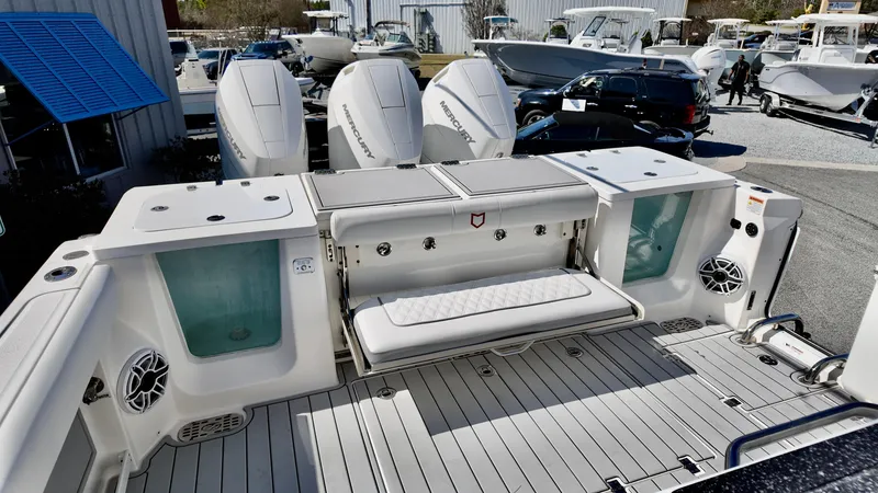 Slide: The Image of 2025 Sea Fox 368 Commander boat deck with seating and storage compartments. - 29