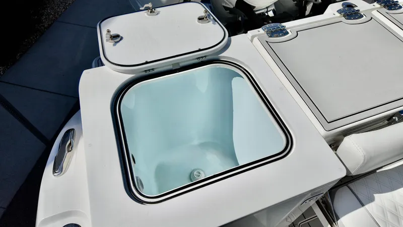 Slide: The Image of 2025 Sea Fox 368 Commander boat storage compartment, open lid, showcasing interior space. - 30