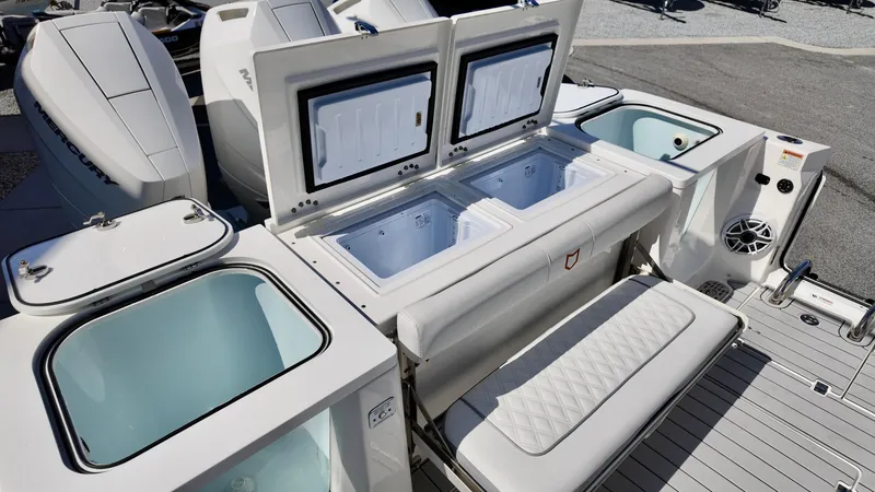 Slide: The Image of 2025 Sea Fox 368 Commander boat with open storage compartments and seating area. - 31