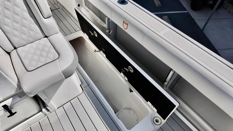 Slide: The Image of 2025 Sea Fox 368 Commander boat interior with open storage compartment and cushioned seating. - 40