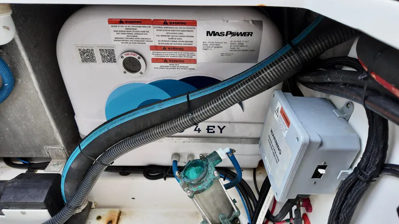 Slide: The Image of Engine compartment of a 2025 Sea Fox 368 Commander boat, featuring wiring and components. - 45