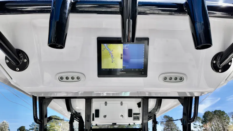 Slide: The Image of 2025 Sea Fox 368 Commander boat console with navigation display and controls. - 6