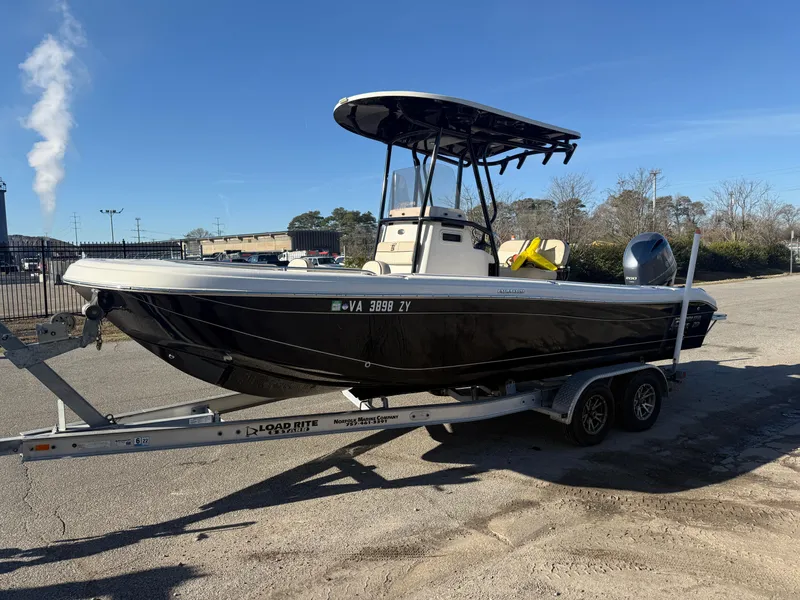 Slide: The Image of 2021 Carolina Skiff 23 Ultra Elite boat on trailer, parked outdoors. - 1