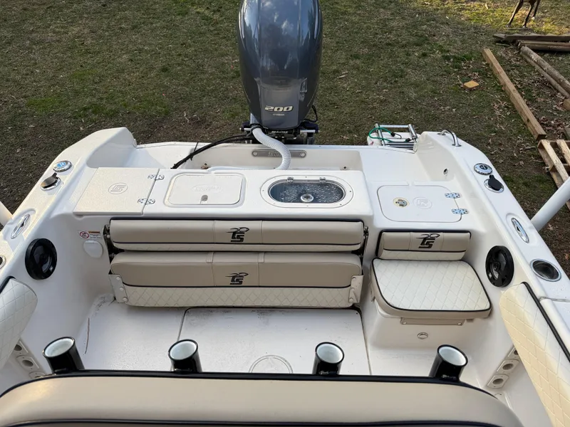 Slide: The Image of 2021 Carolina Skiff 23 Ultra Elite boat interior with seating and storage compartments. - 5