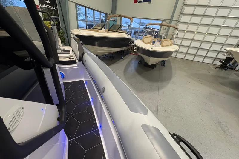 Slide: The Image of 2026 Highfield ADV7 boat in showroom with sleek design and modern features. - 17