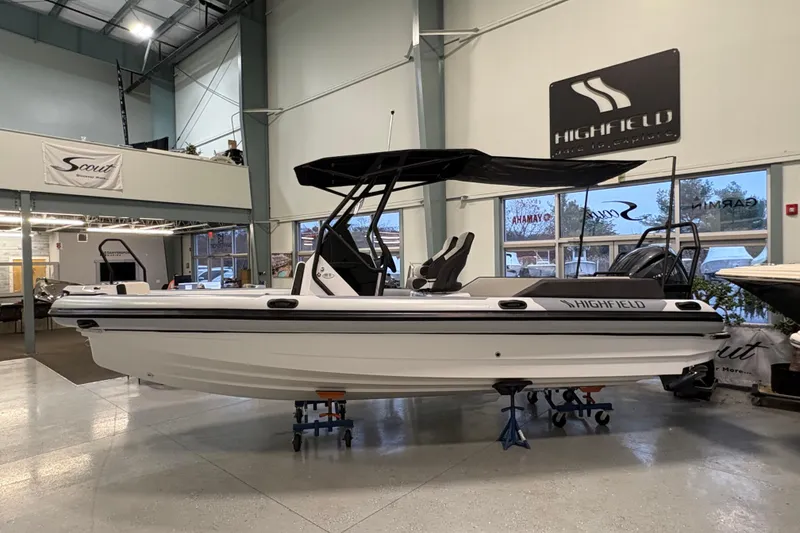 Slide: The Image of 2026 Highfield ADV7 boat displayed indoors, featuring sleek design and modern amenities. - 3