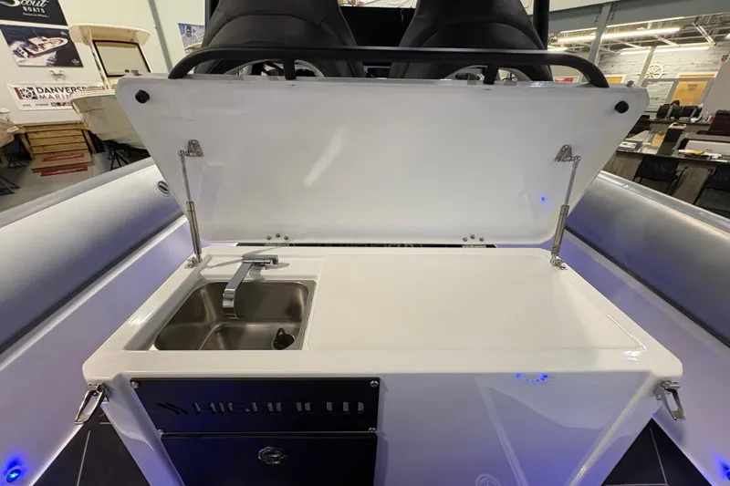 Slide: The Image of 2026 Highfield ADV7 boat with open sink compartment, showcasing modern design and functionality. - 9