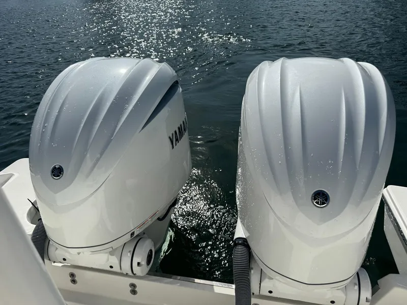Slide: The Image of Twin Yamaha outboard engines on a 2022 Pursuit S 328 Sport boat. - 17