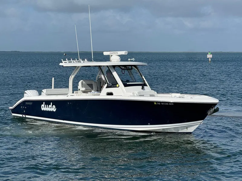 Slide: The Image of 2022 Pursuit S 328 Sport boat cruising on open water. - 2