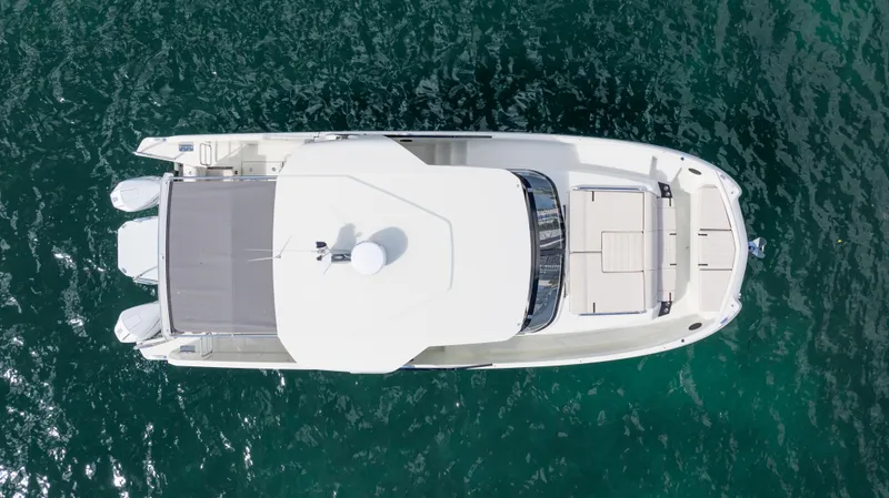 Slide: The Image of Aerial view of 2025 YOT 36 boat on clear blue water. - 10