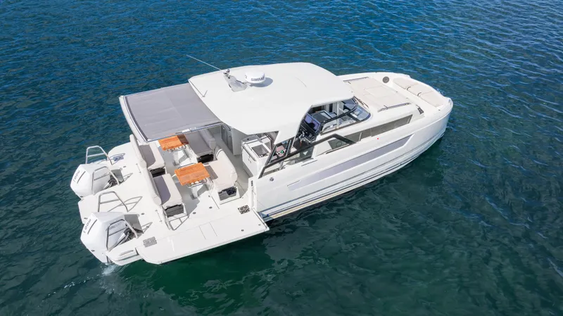 Slide: The Image of 2025 YOT 36 boat on clear blue water, featuring spacious deck and modern design. - 14