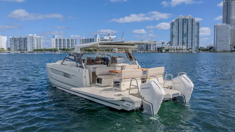 Slide: The Image of Luxurious 2025 YOT 36 yacht cruising near city skyline on a sunny day. - 16