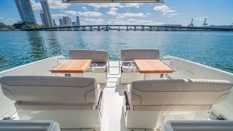 Slide: The Image of Luxury YOT 36 yacht interior with waterfront cityscape, 2025 model. - 17