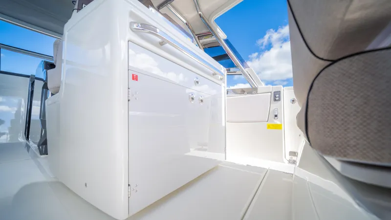 Slide: The Image of 2025 YOT 36 boat interior with sleek white cabinetry and modern design. - 23