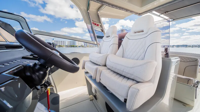 Slide: The Image of Luxurious interior of 2025 YOT 36 boat with plush seating and modern steering. - 26