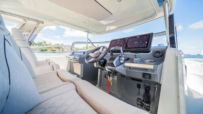 Slide: The Image of Luxurious YOT 36 boat interior, 2025 model, featuring advanced navigation systems and plush seating. - 27