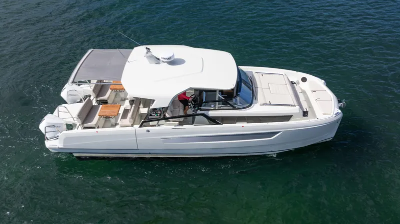 Slide: The Image of 2025 YOT 36 boat cruising on open water, featuring sleek design and spacious deck. - 3
