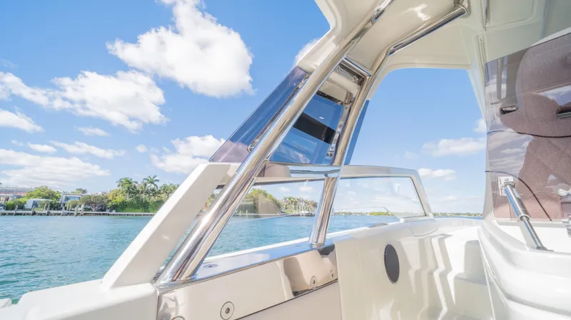 Slide: The Image of 2025 YOT 36 boat interior with scenic water view and clear blue sky. - 31