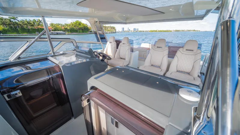 Slide: The Image of Luxurious 2025 YOT 36 boat interior with plush seating and scenic water view. - 34