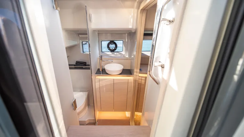 Slide: The Image of Modern bathroom interior on 2025 YOT 36 yacht, featuring sleek design and compact functionality. - 35
