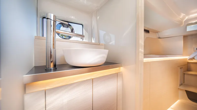 Slide: The Image of Modern bathroom interior of 2025 YOT 36 yacht with sleek sink and minimalist design. - 39