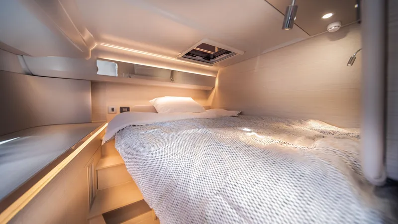 Slide: The Image of Luxurious cabin interior of 2025 YOT 36 yacht with cozy bedding and modern lighting. - 41