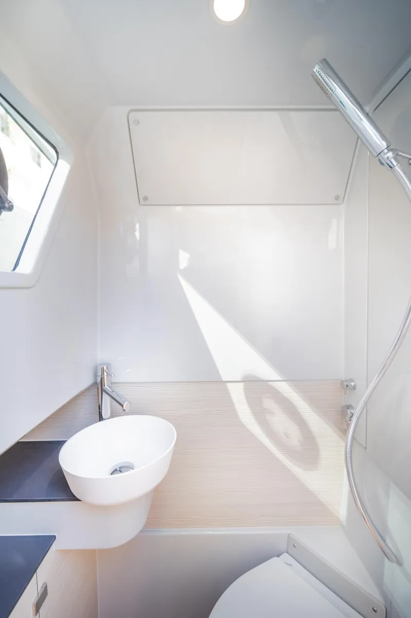 Slide: The Image of Modern YOT 36 yacht bathroom with sleek design, featuring a round sink and shower. - 46