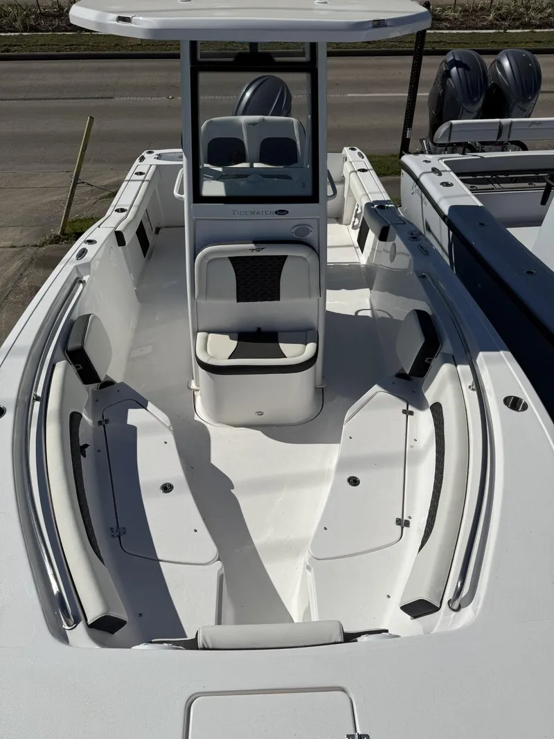 Slide: The Image of 2025 Tidewater 232 CC Adventure boat with spacious seating and modern design. - 6