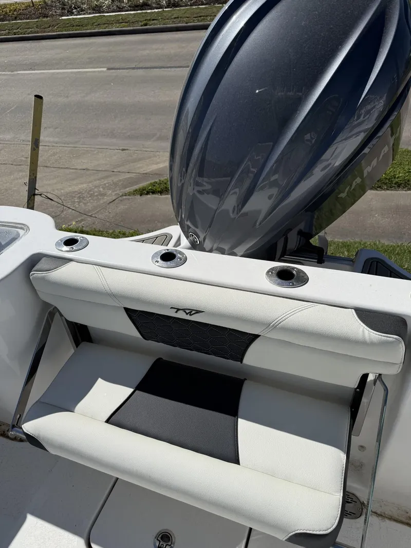 Slide: The Image of 2025 Tidewater 232 CC Adventure boat with sleek seating and powerful engine. - 7