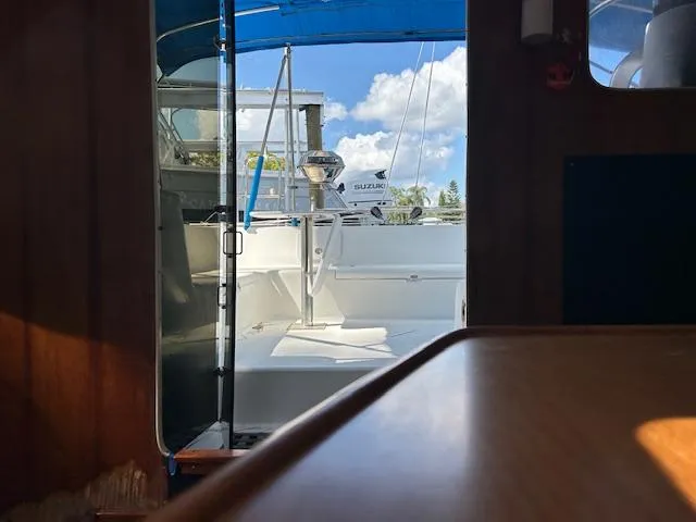 Slide: The Image of Interior view of 1995 Lagoon TPI 37 sailboat with open door to deck. - 11