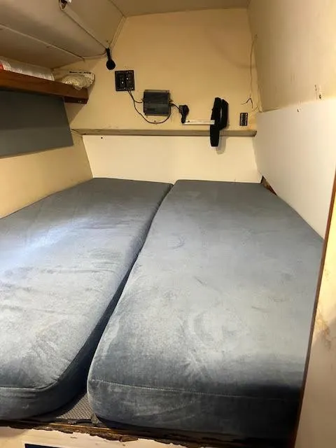 Slide: The Image of Interior cabin of 1995 Lagoon TPI 37 with twin beds and nautical equipment. - 13