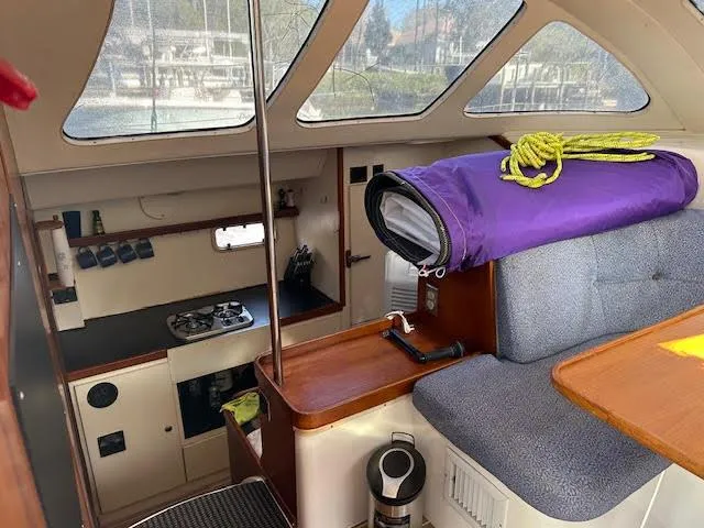 Slide: The Image of Interior of 1995 Lagoon TPI 37 sailboat with kitchen and seating area. - 15