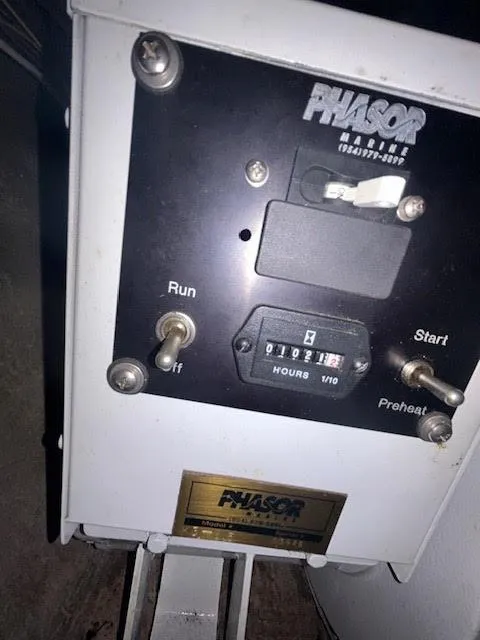 Slide: The Image of Phasor Marine generator control panel on a 1995 Lagoon TPI 37 yacht. - 32