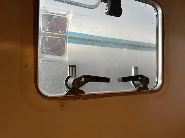 Slide: The Image of Window view from inside a 1995 Lagoon TPI 37 boat cabin. - 33