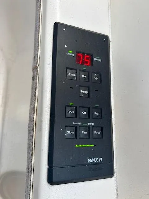 Slide: The Image of Control panel of a 1995 Lagoon TPI 37 boat, displaying temperature settings. - 39