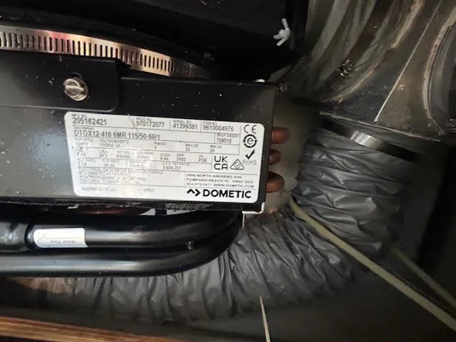 Slide: The Image of Dometic appliance label inside a 1995 Lagoon TPI 37 yacht, showing specifications and certifications. - 40